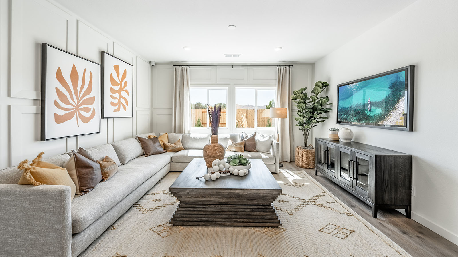 Modern living room with bright fun decor and room for a sectional couch