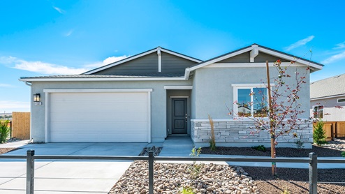 Second model home in the Nevada Sky community with stucco and stone exterior