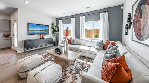 Living room with large windows and room for a sectional sofa