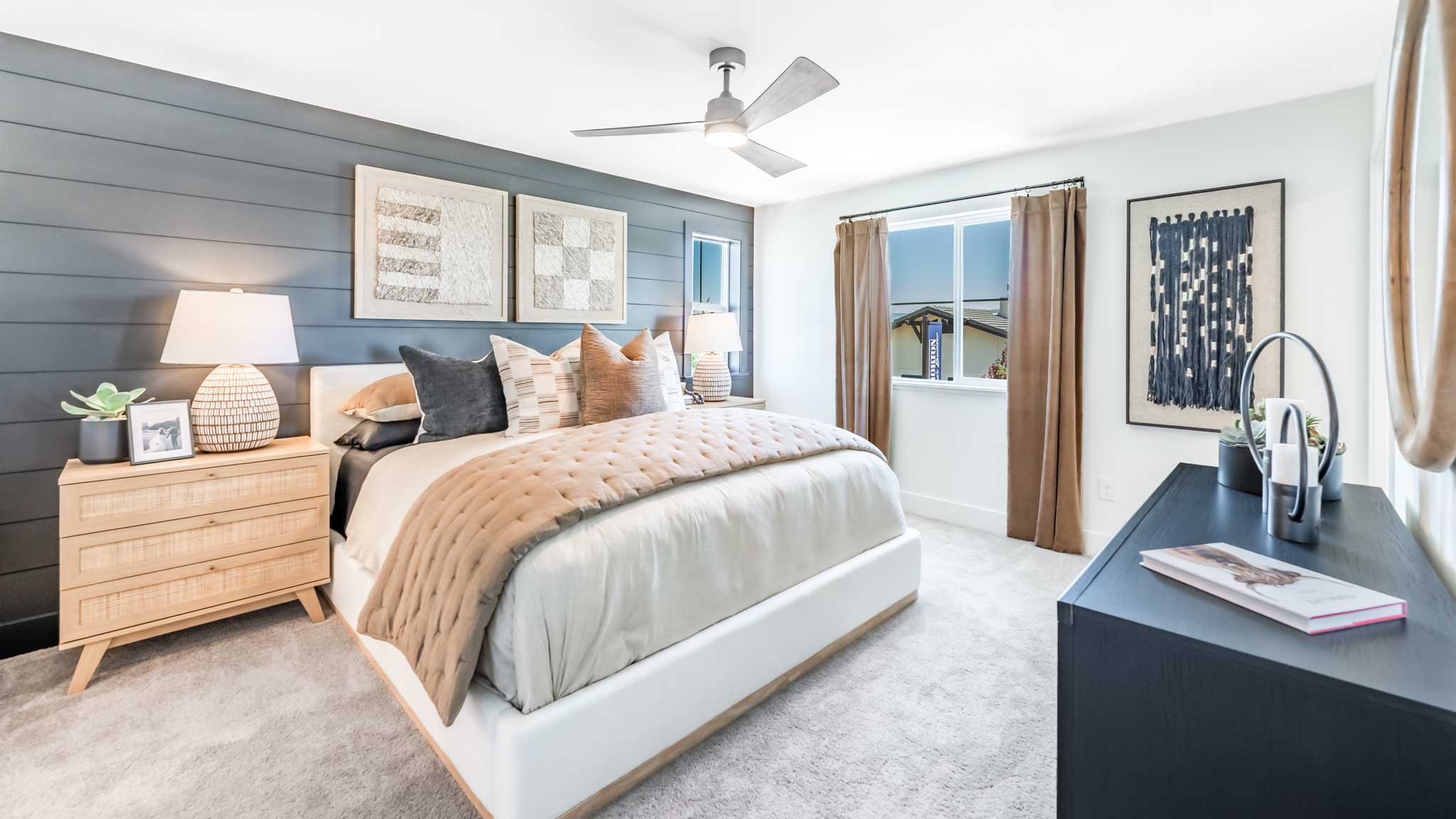Bright primary bedroom with a large window
