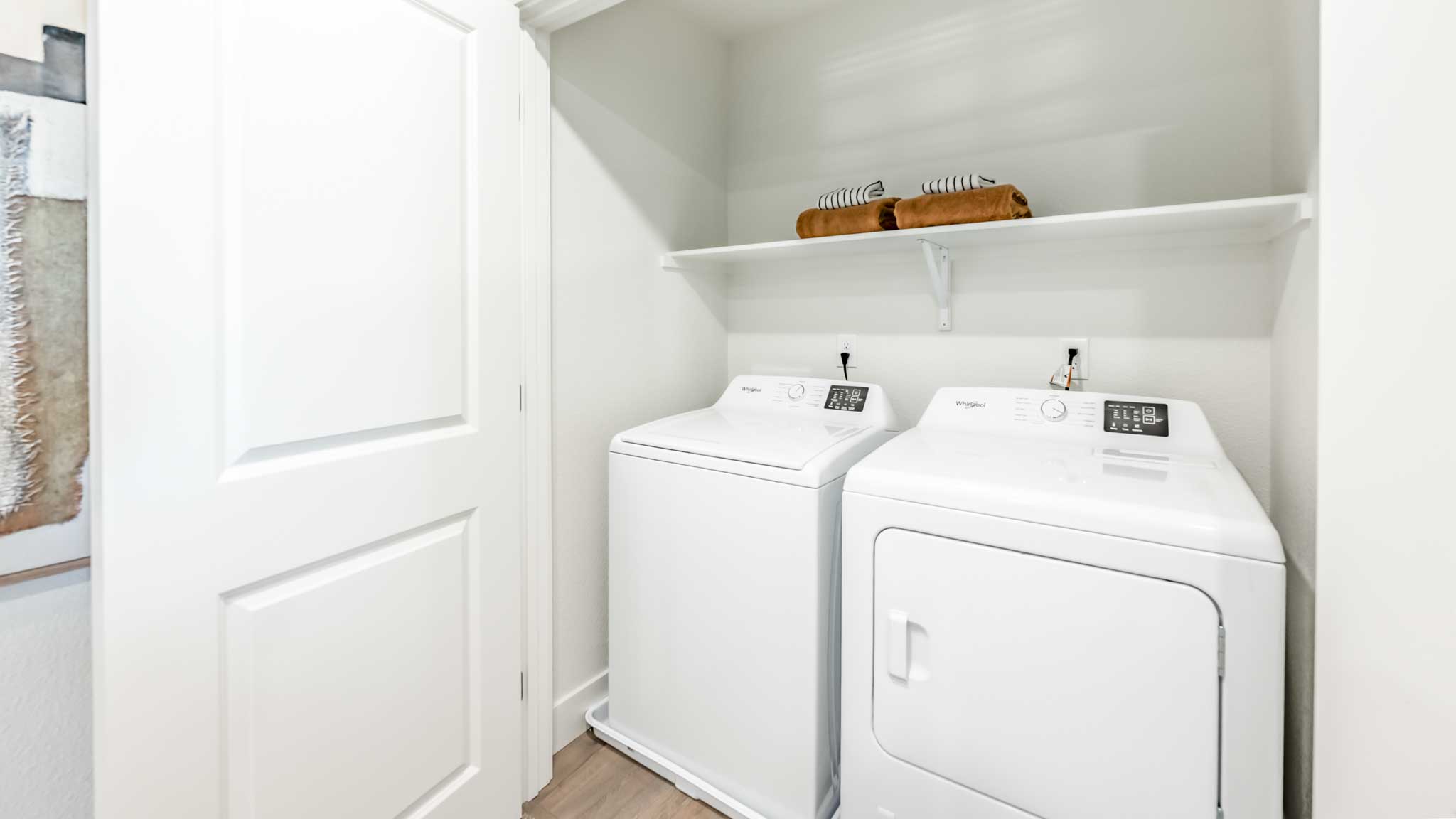 Laundry area with shelving