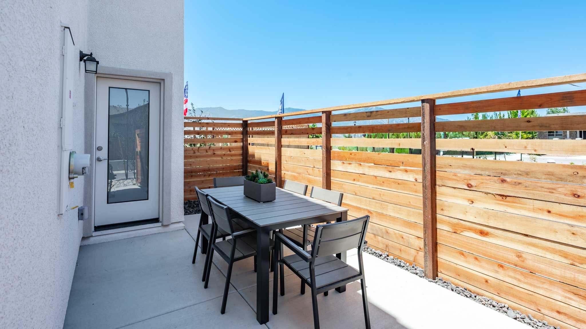 Private outdoor sitting area looking towards the backdoor