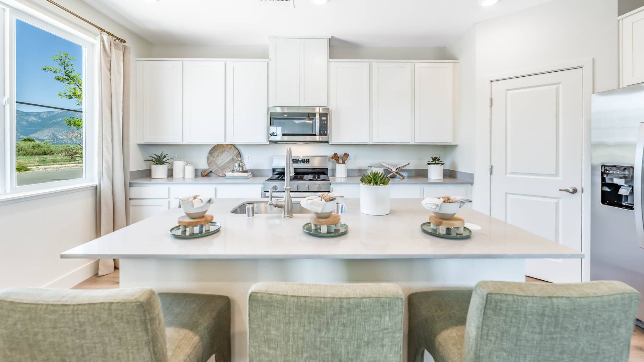 Kitchen island looking towards the appliances and cabinets