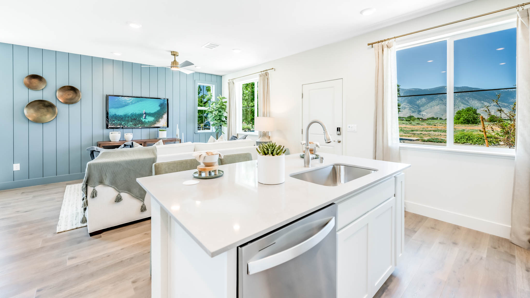 Kitchen island with a dishwasher and sink
