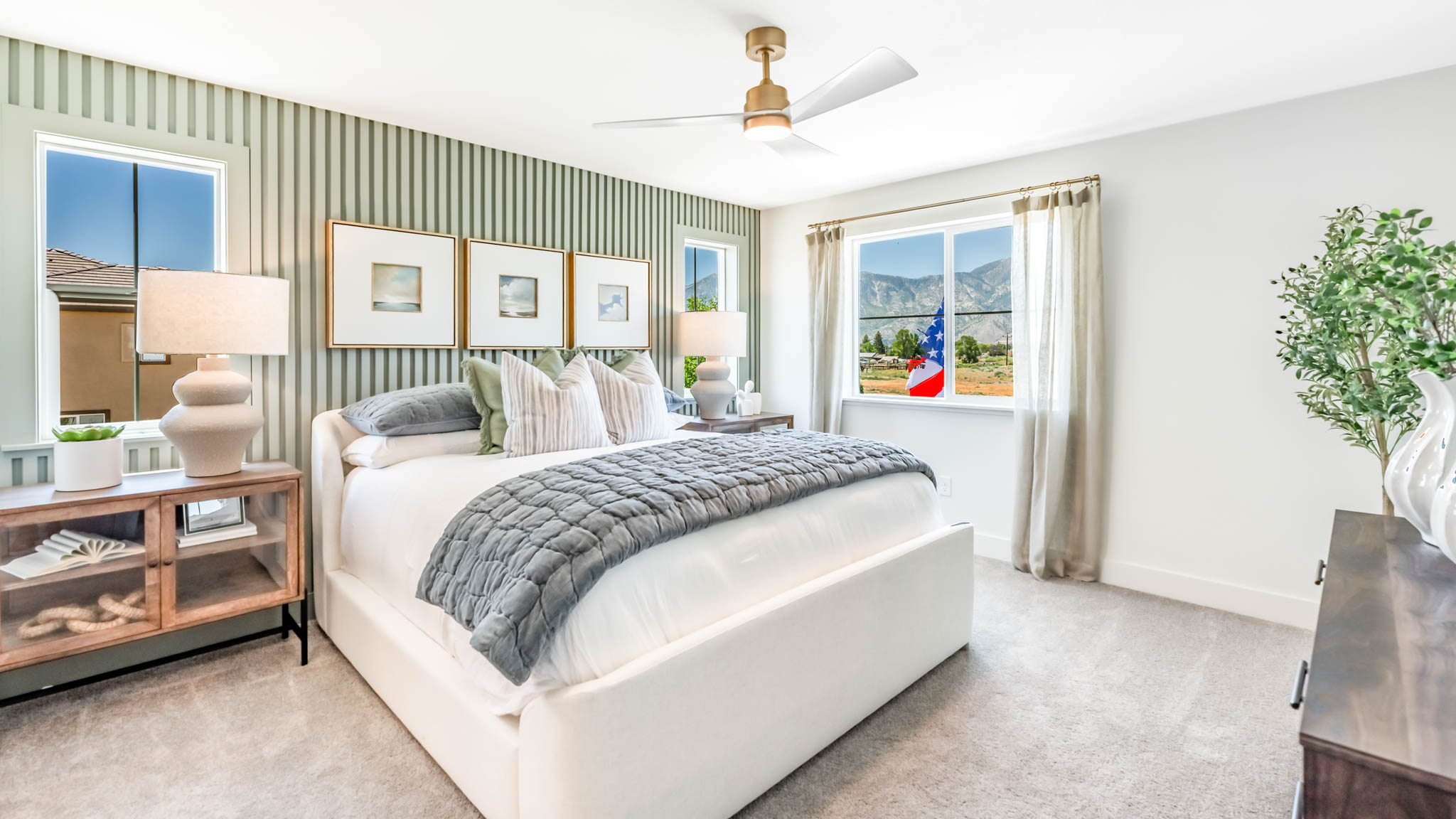 Bright primary bedroom with a large window