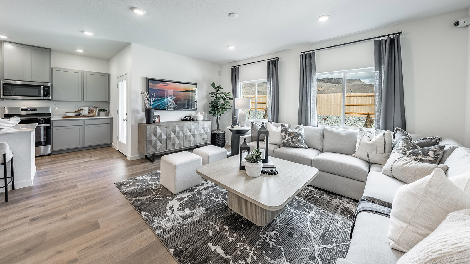 Large windows letting in natural light in living area