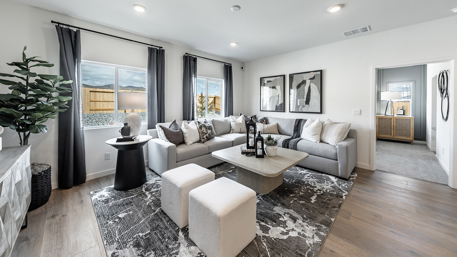 Modern living room space next to primary bedroom