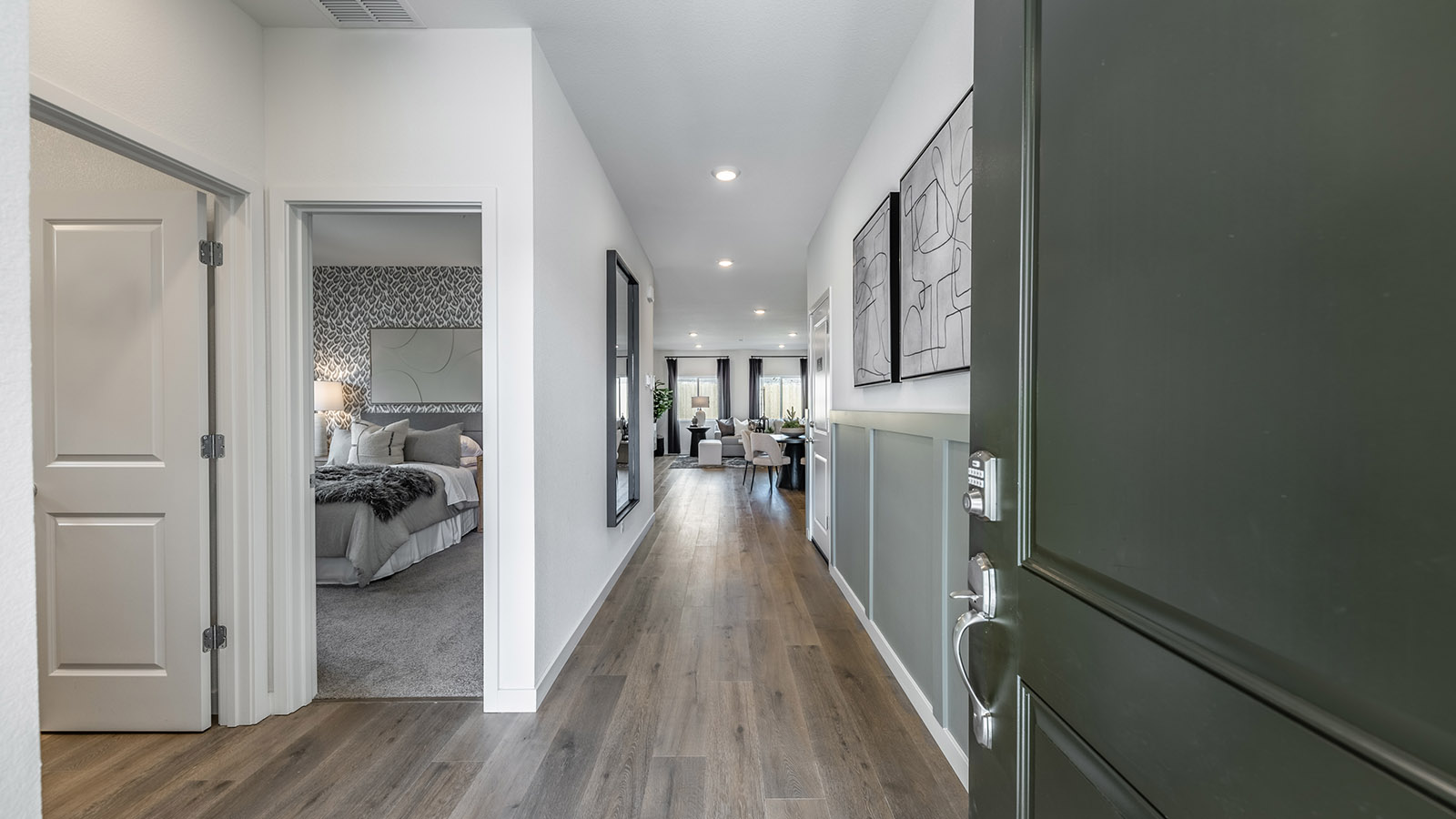 Entry of the Topaz floorplan with a secondary bathroom and bedroom at the front of the home