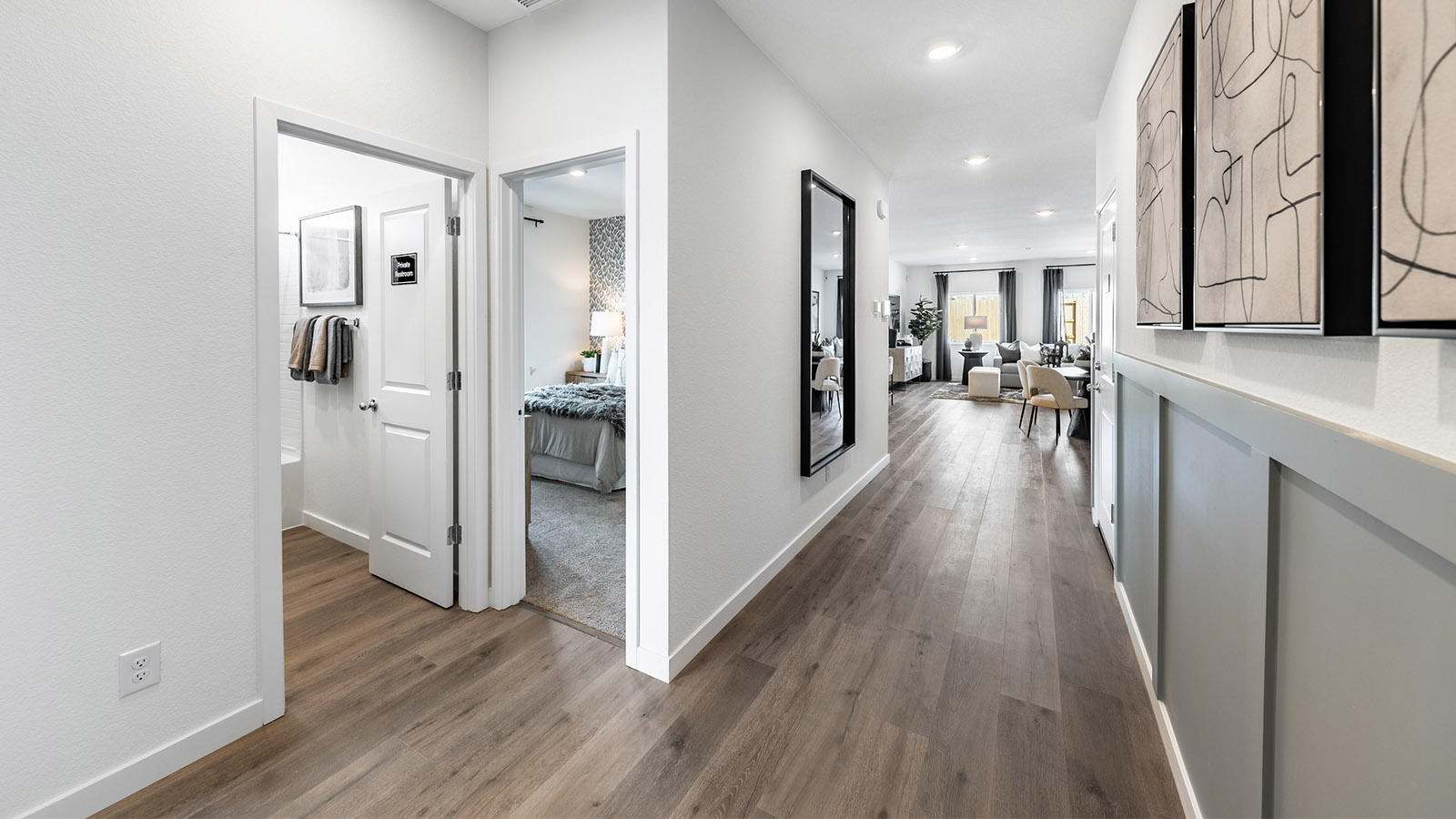 Entry way with views into secondary bedroom and bathroom