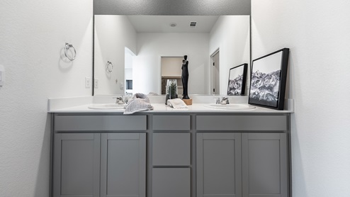 Grey bathroom vanity and large mirror