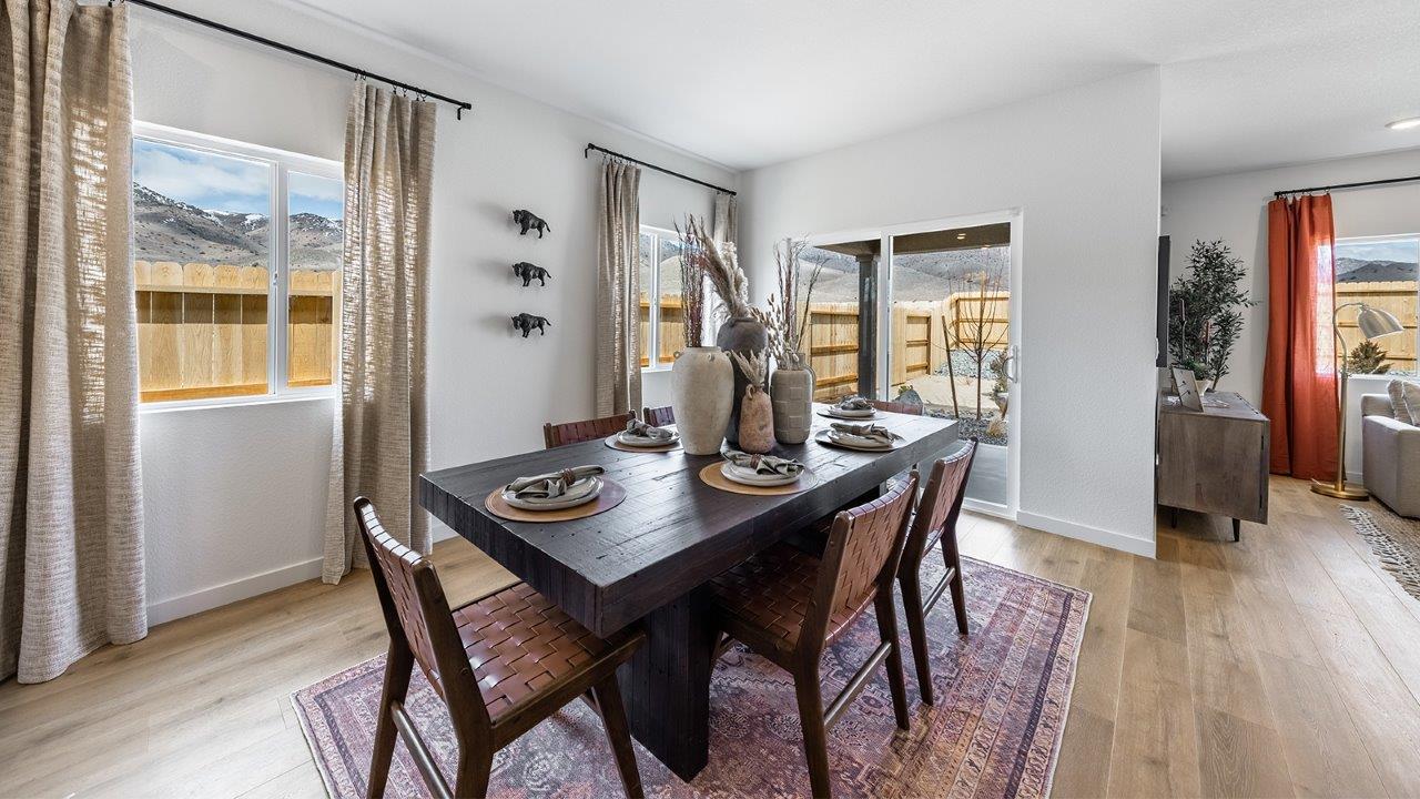 Bright dining area next to back door to the yard
