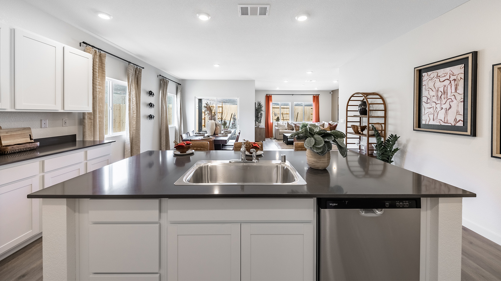 Kitchen island with sink and stainless steel dishwasher