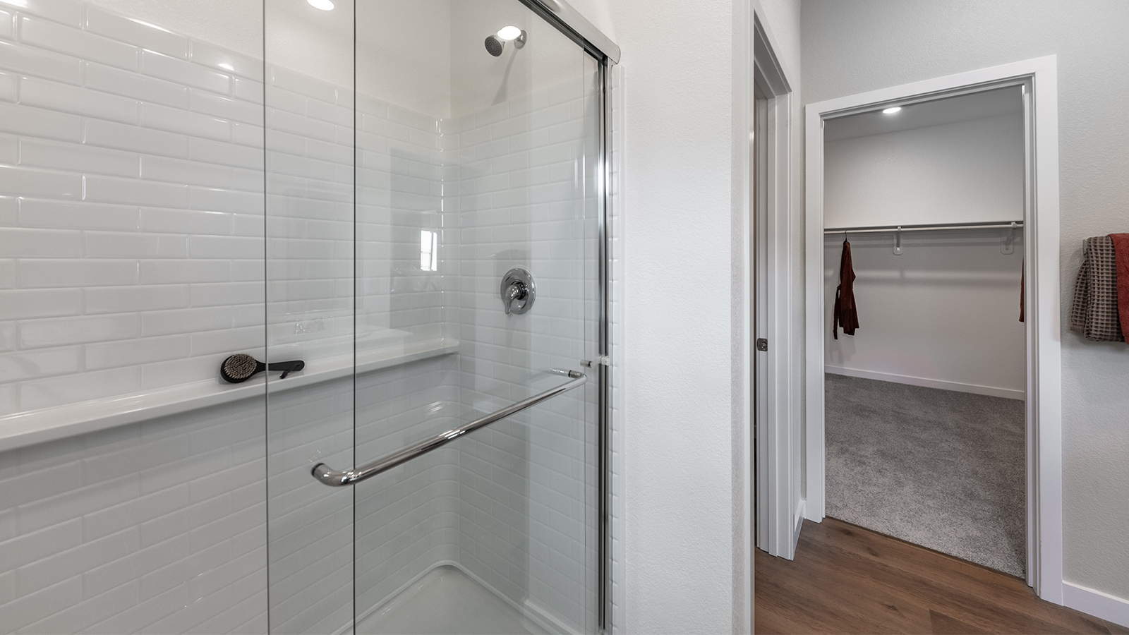 Walk-in shower next to walk-in closet