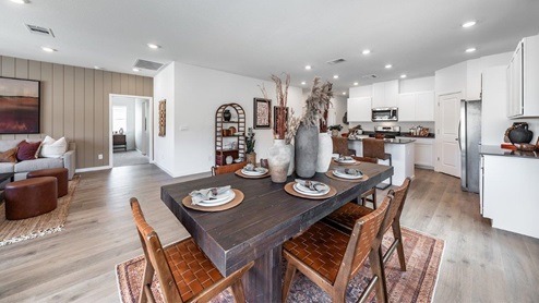 Open concept living area with adjoining kitchen, dining, and living area