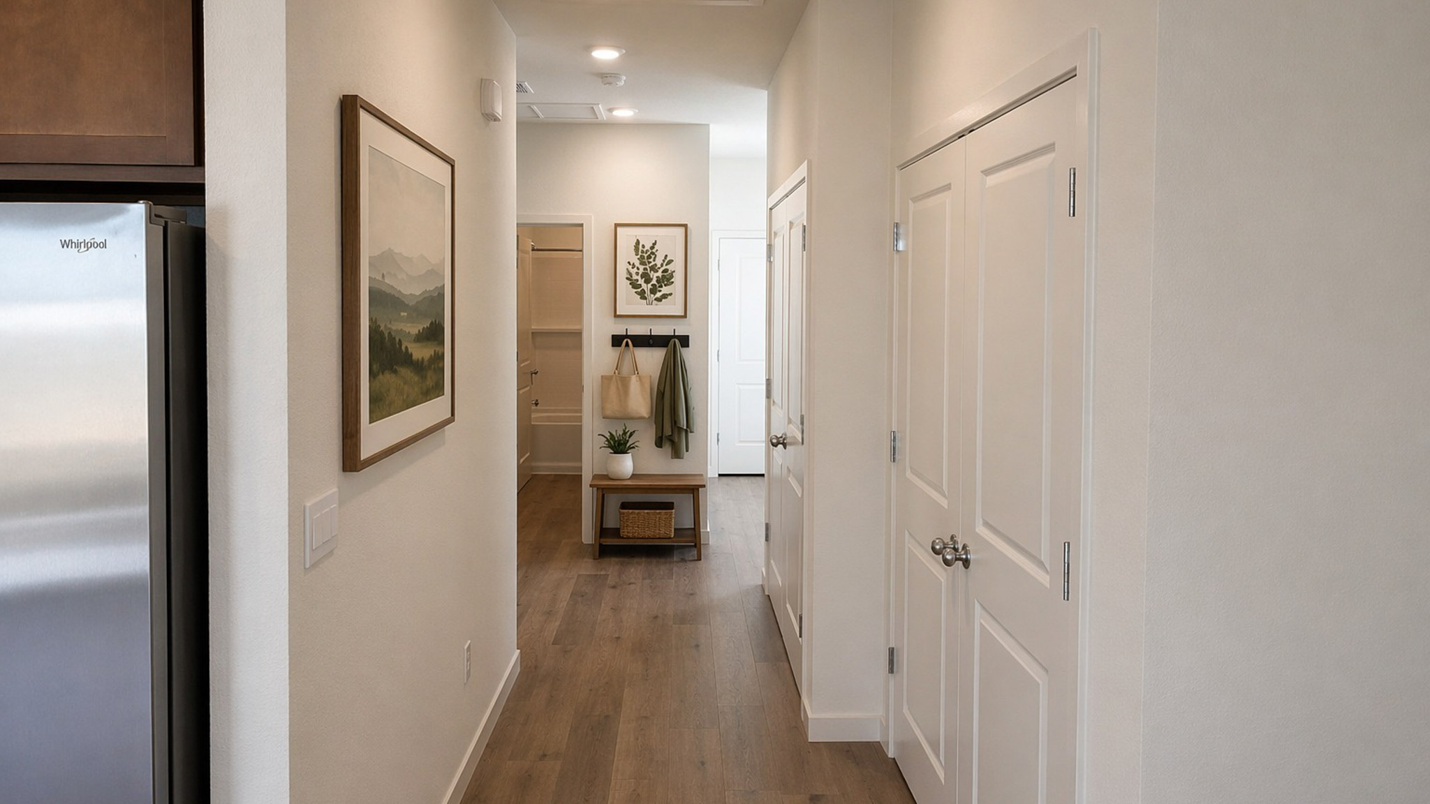 Hallway in the Glacier floorplan rendered with a drop zone at the entrance and art in the hallway