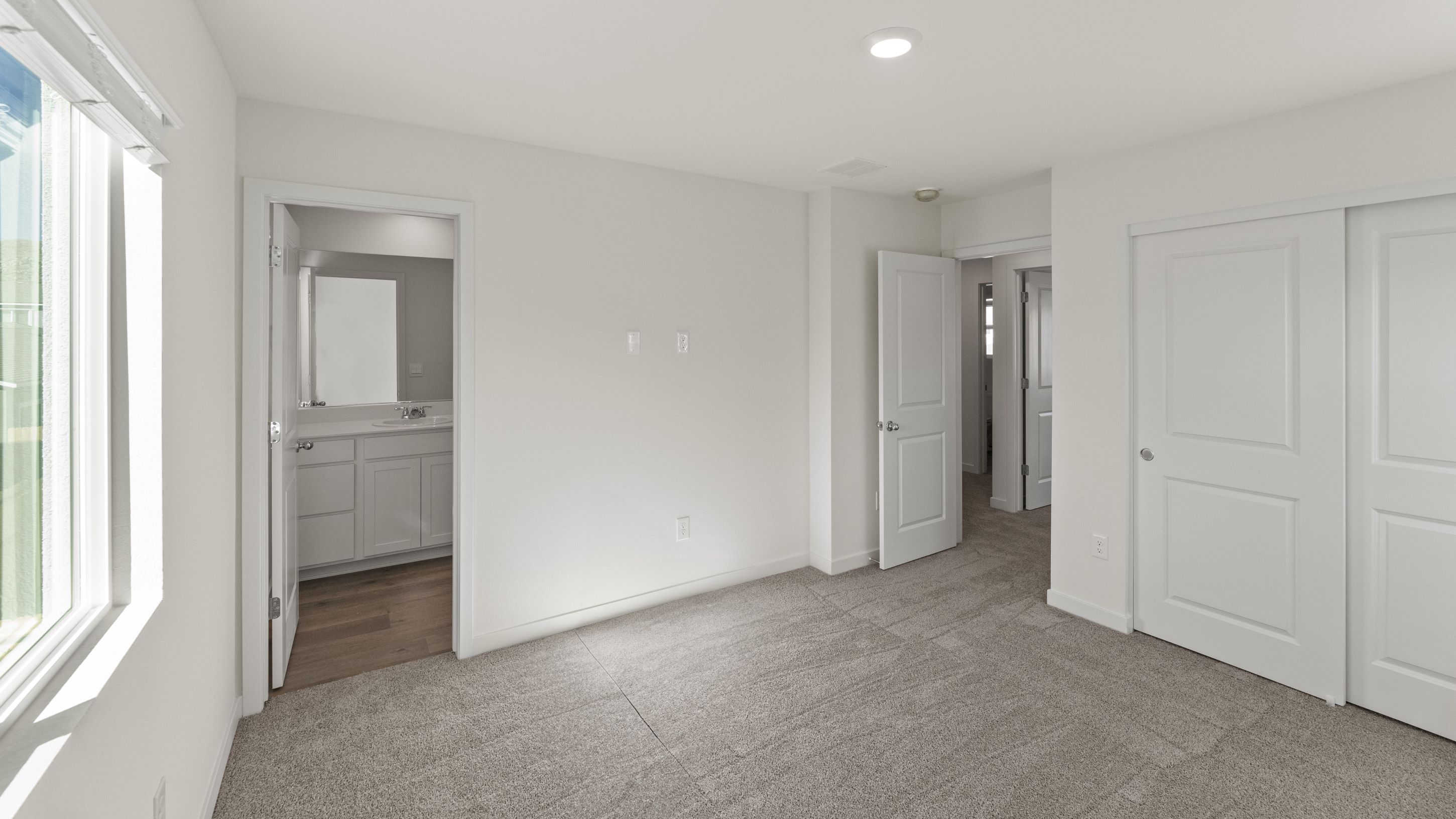 Primary bedroom looking towards primary bathroom