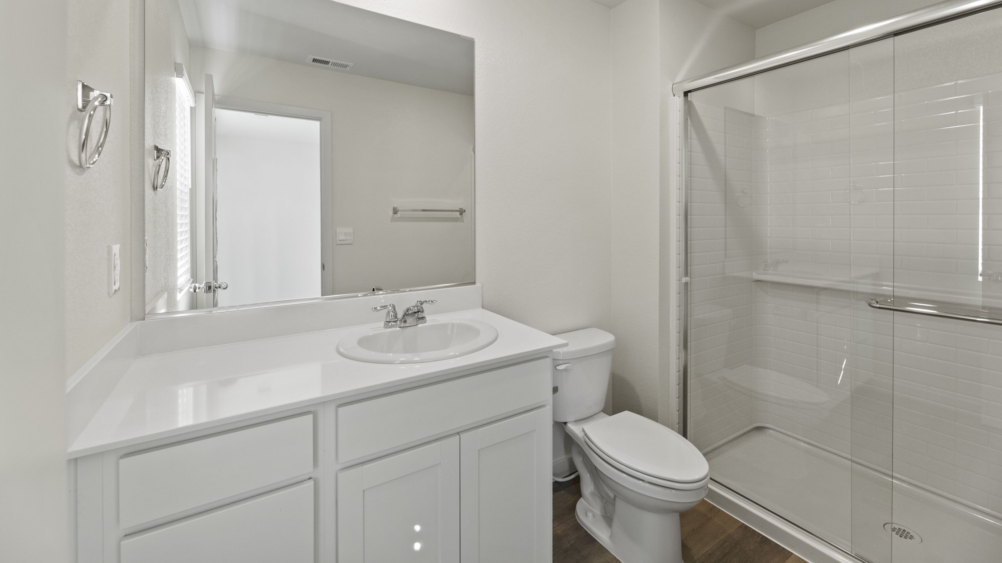 Primary bathroom with vanity and walk-in shower