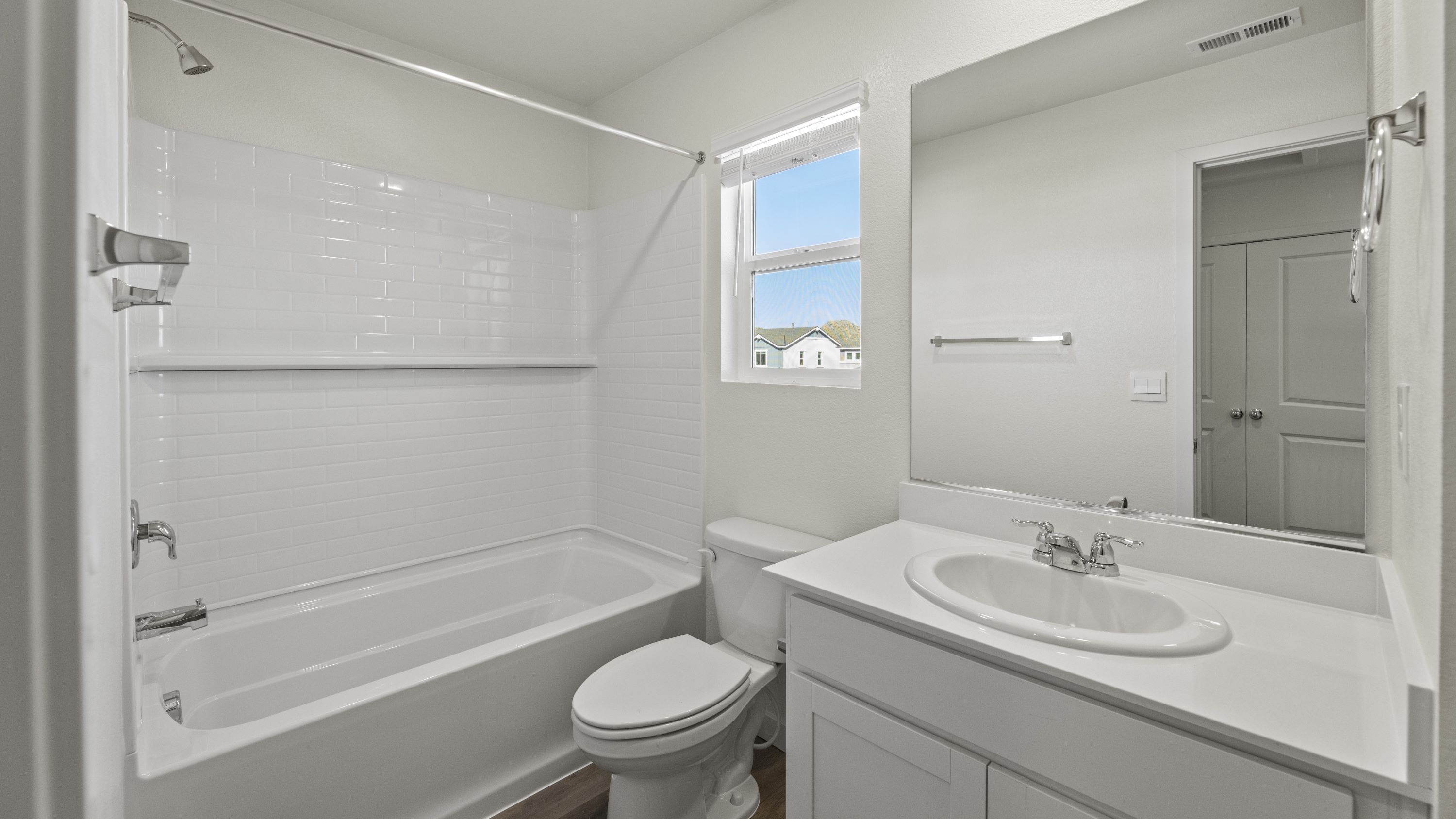 Secondary bathroom with bathtub and shower combo