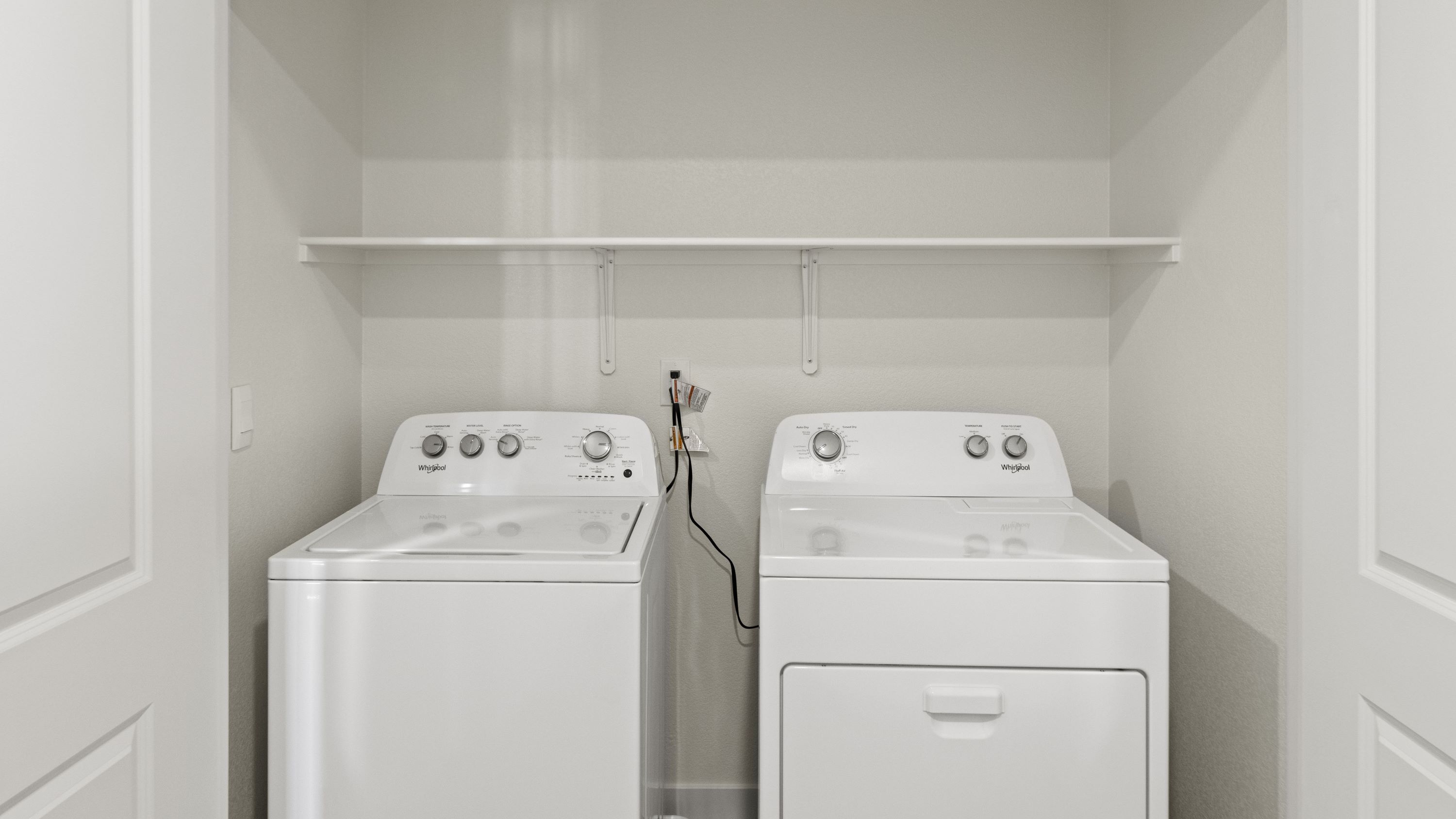 Laundry closet with full-sized washer and dryer