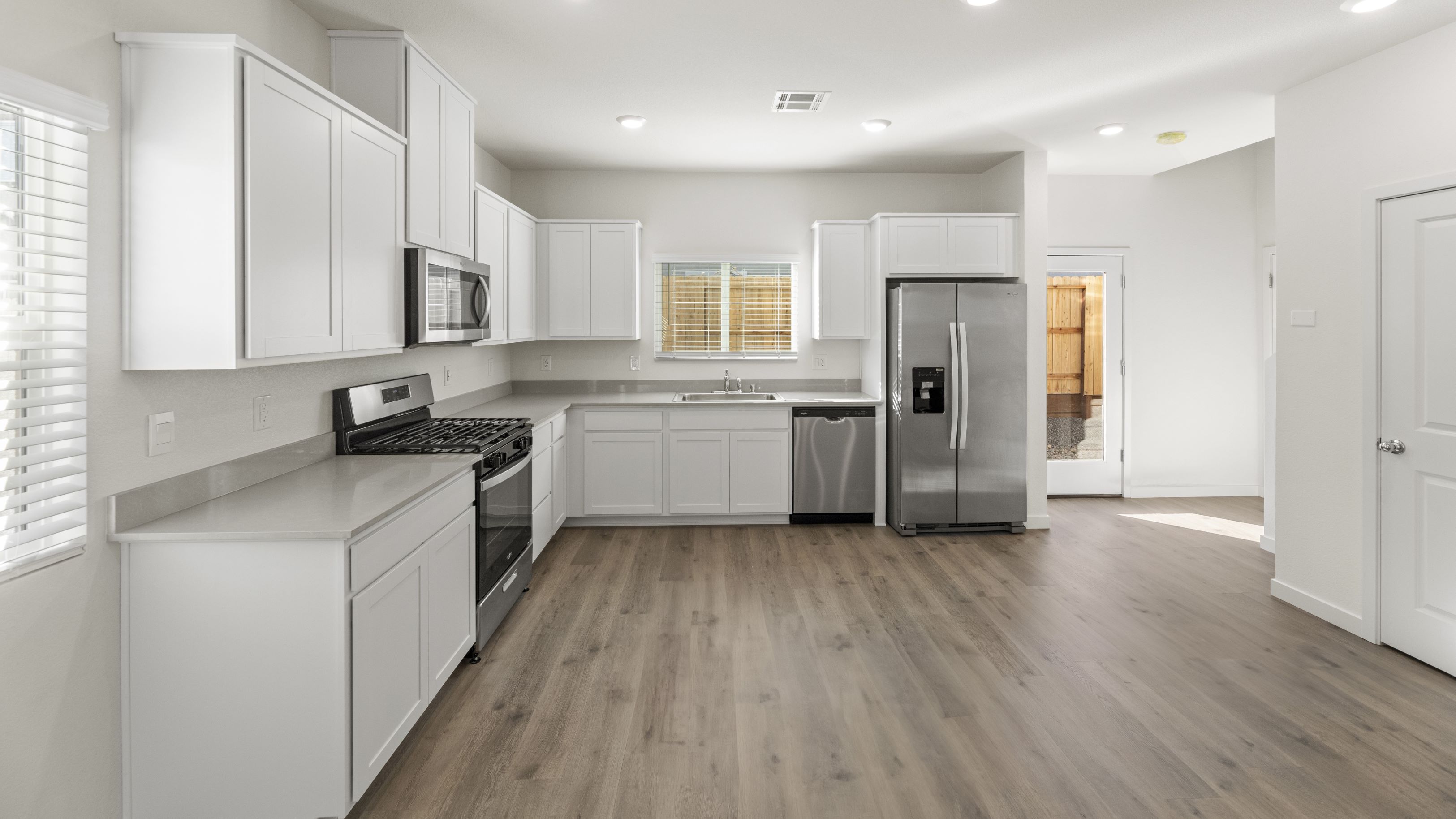 Modern kitchen with shaker-style cabinetry and stainless steel appliances
