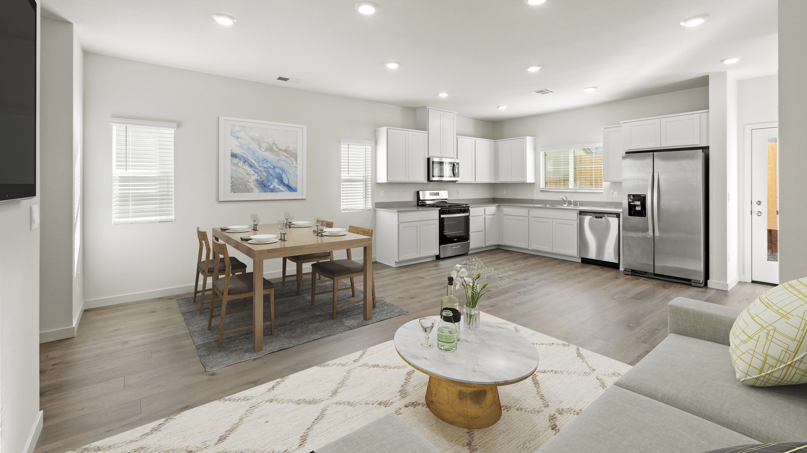 Virtually staged great room looking towards kitchen and dining room