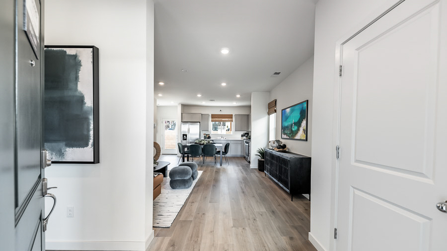 A view through the front door of the Saguaro model home into the open-concept living space.