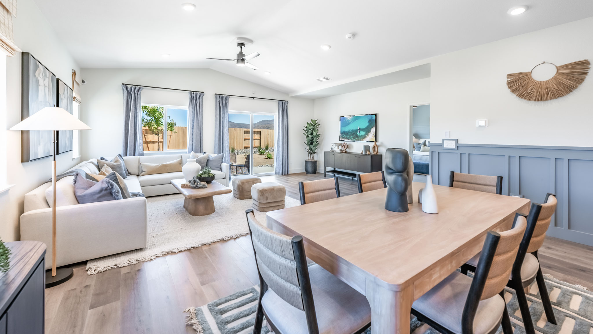 Dining room table in between living room and kitchen