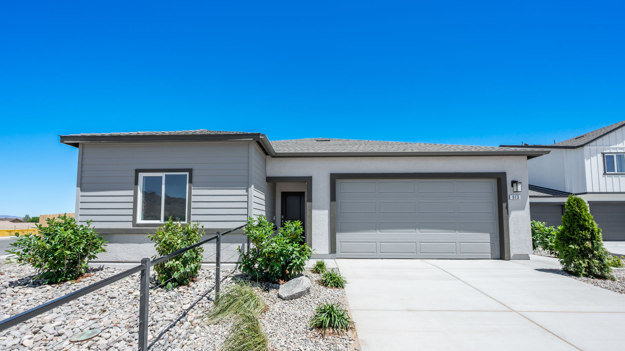 Single-story Shasta floorplan with siding and stucco exterior
