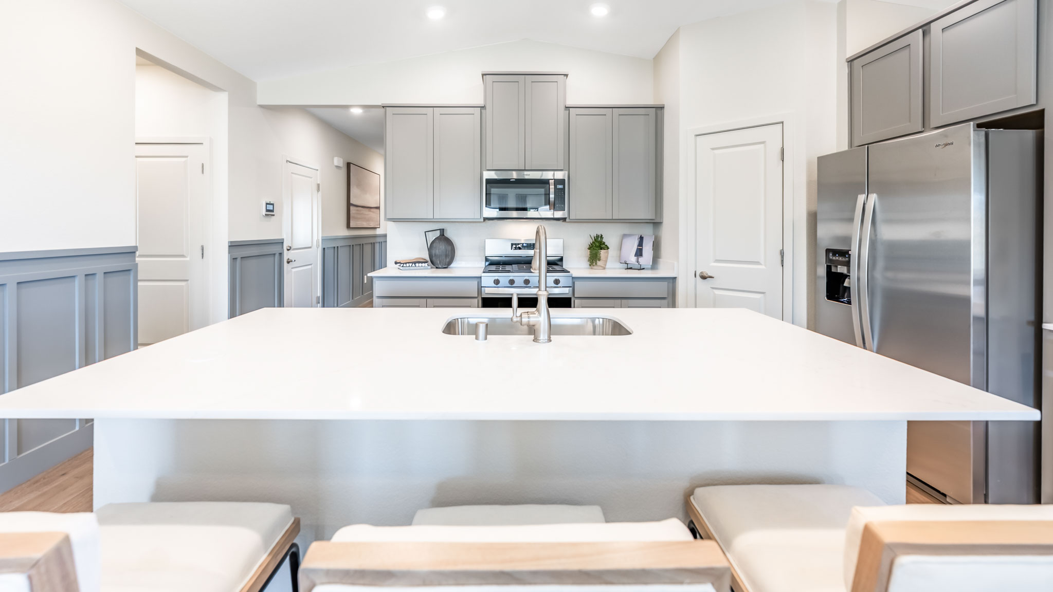 Large kitchen island and stainless-steel appliances