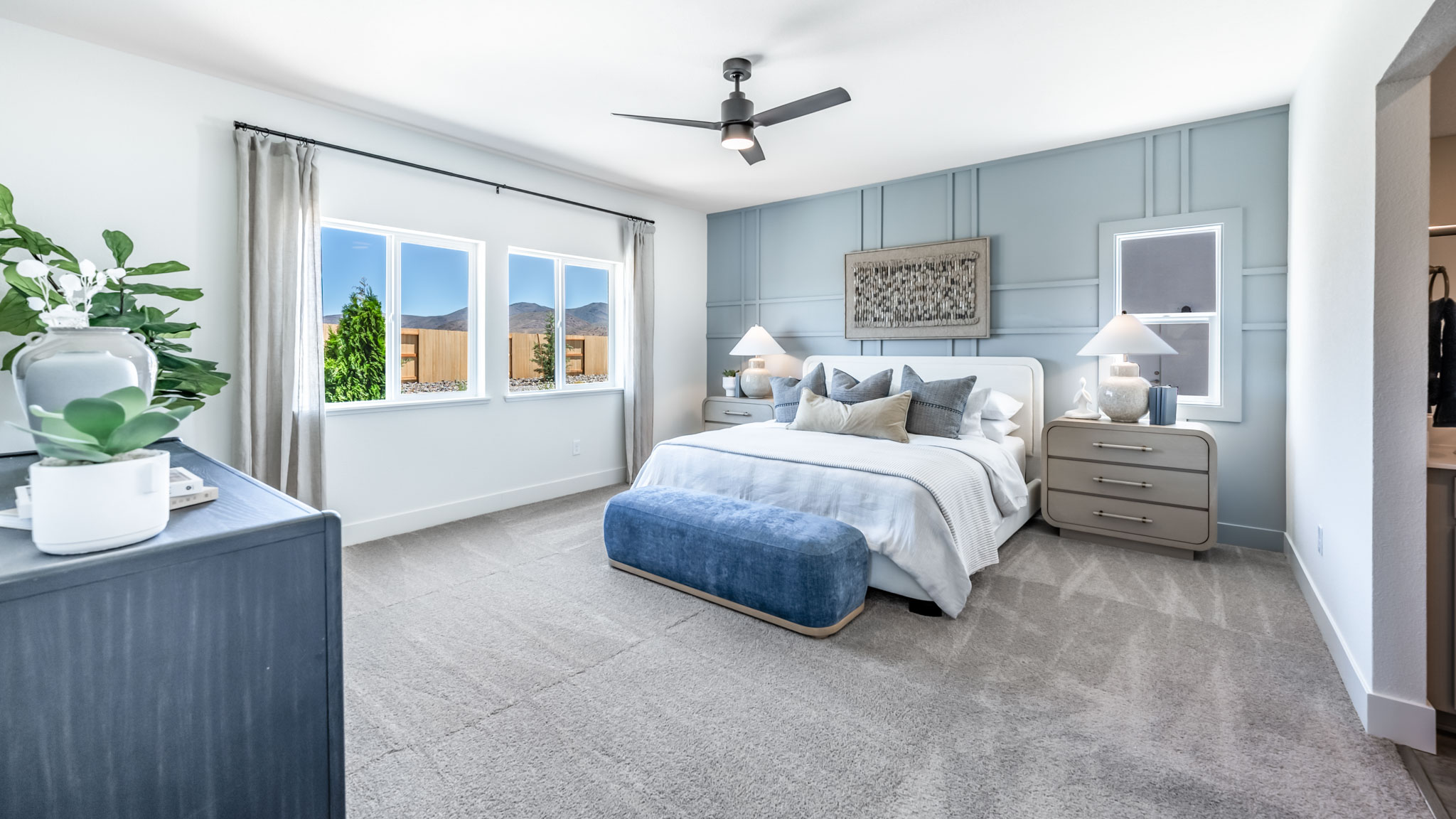 Bright primary bedroom with large window