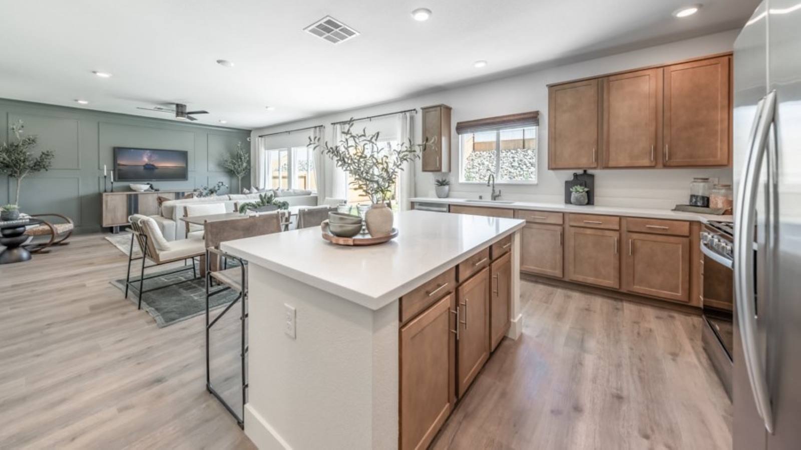 Bright open kitchen with window above the sink and an island