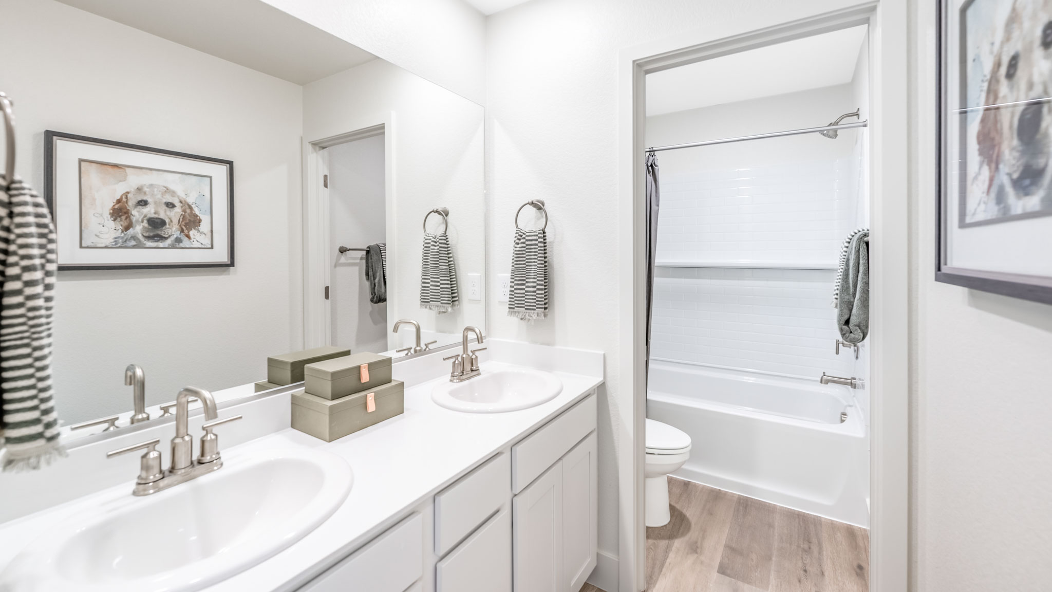 Secondary bathroom with separate room for toilet and bathtub and shower combo
