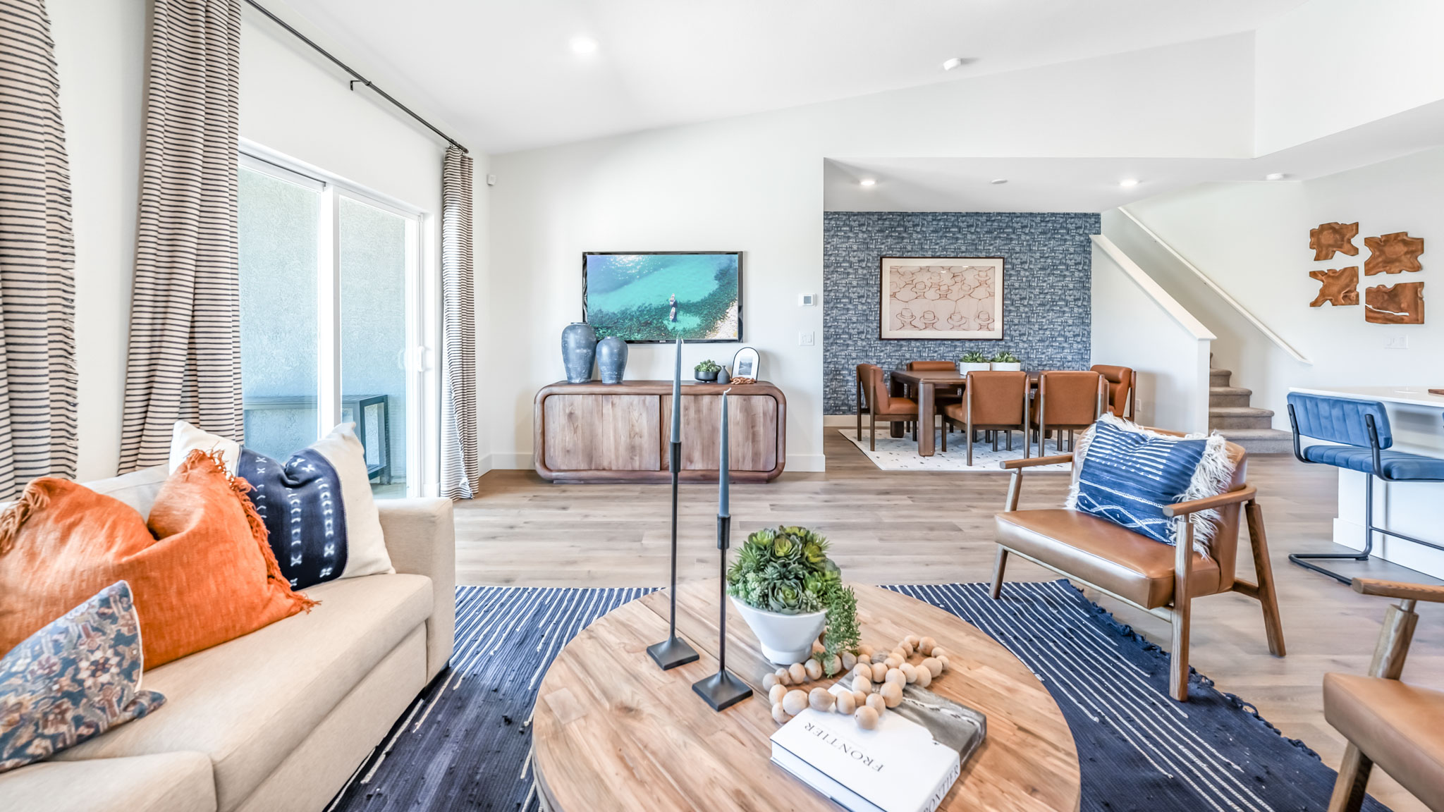 Open-concept first floor living room with bright natural light