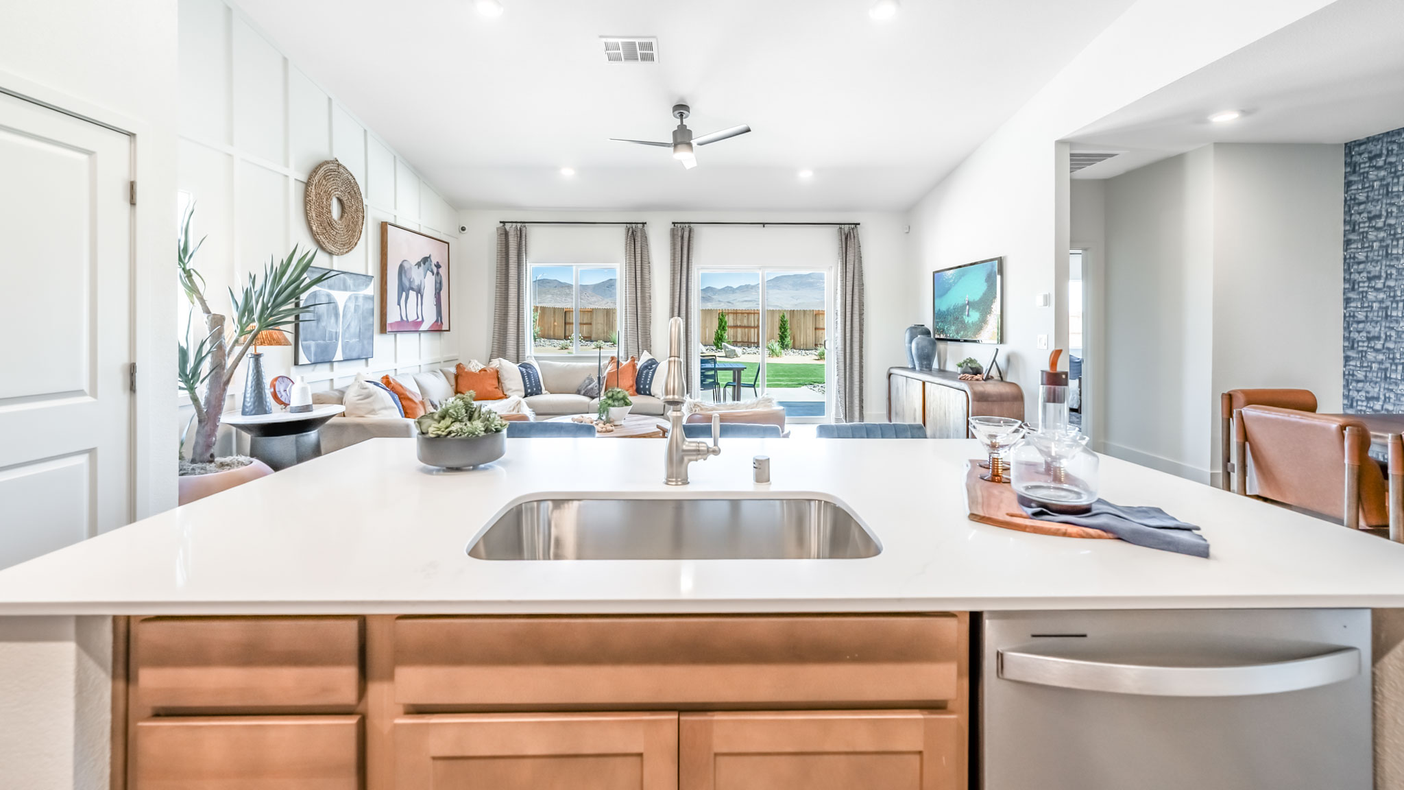 Bright modern kitchen with island, large pantry and the sink