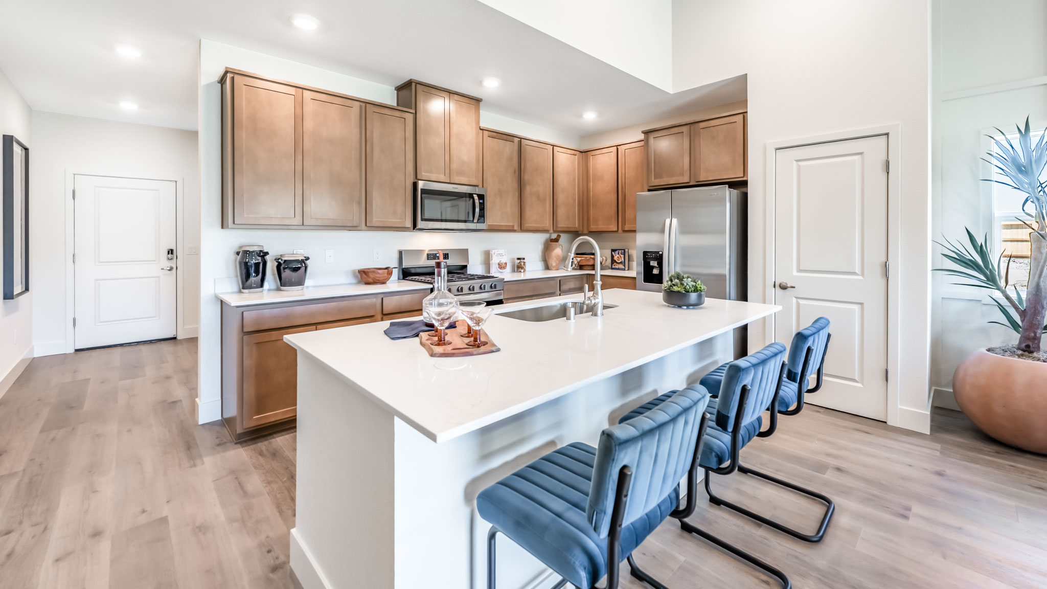 Bright modern kitchen with island and large pantry