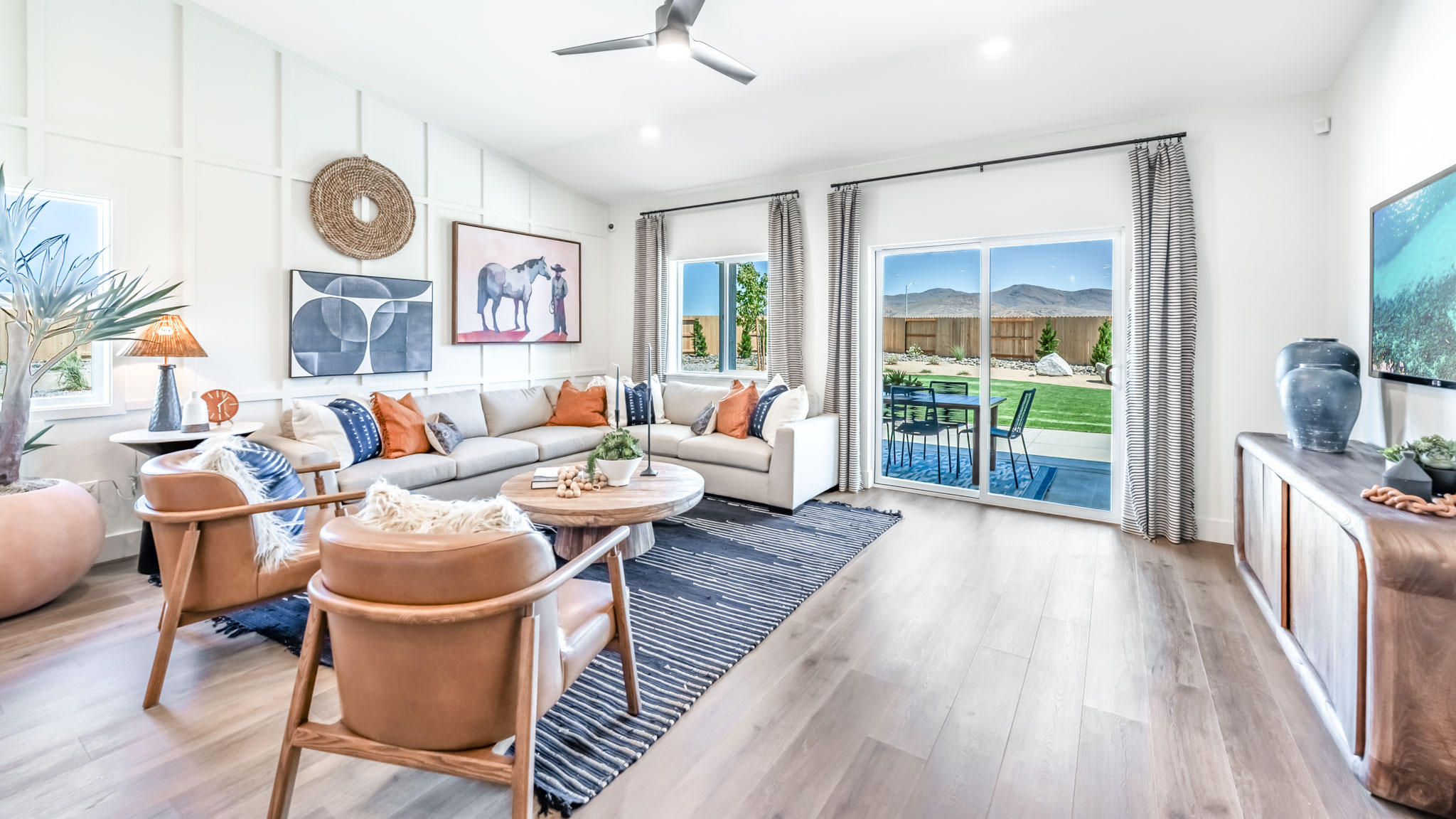 Living room with space for a large sectional couch and large bright windows