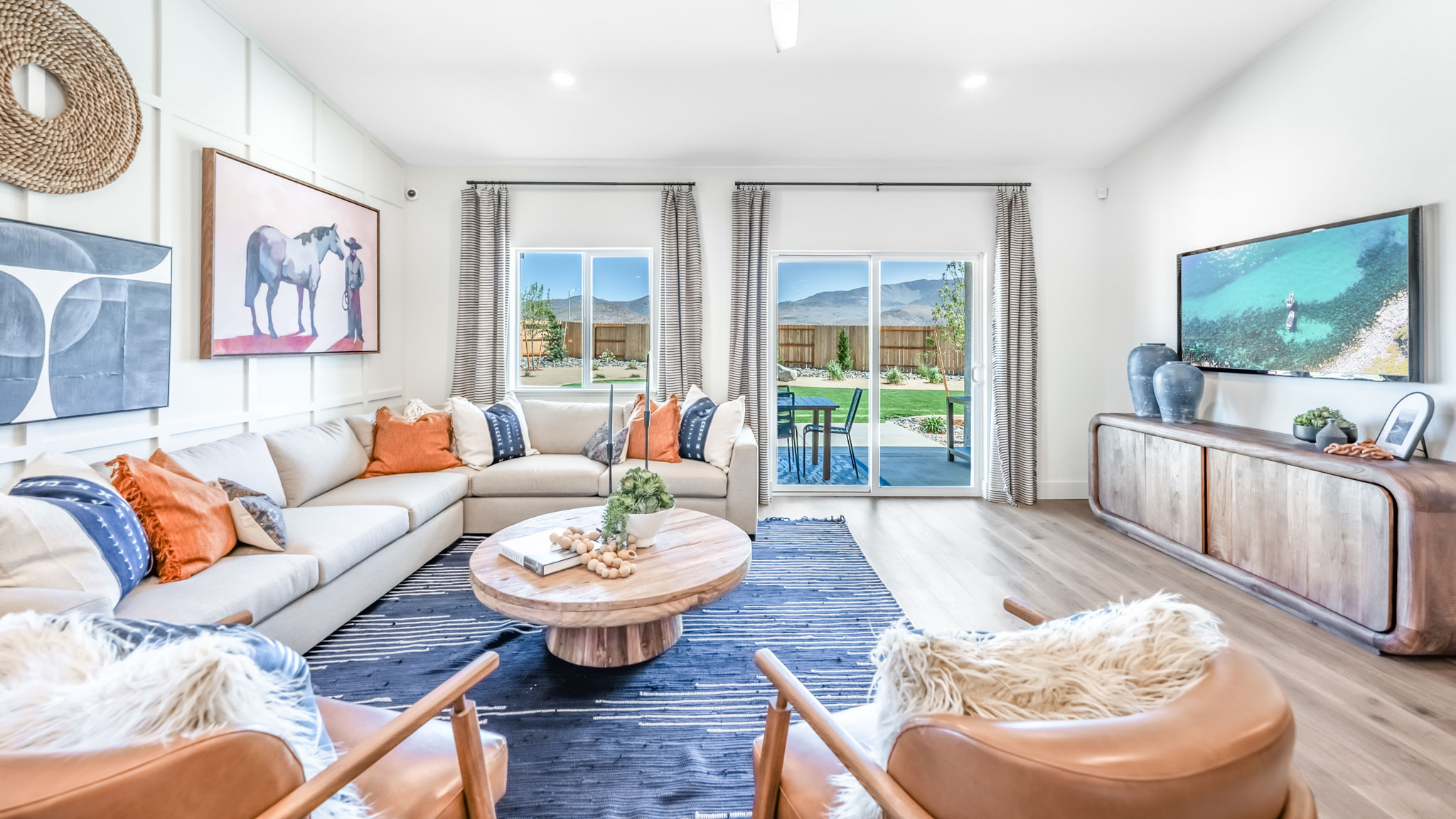 Modern living room with windows looking out into back yard