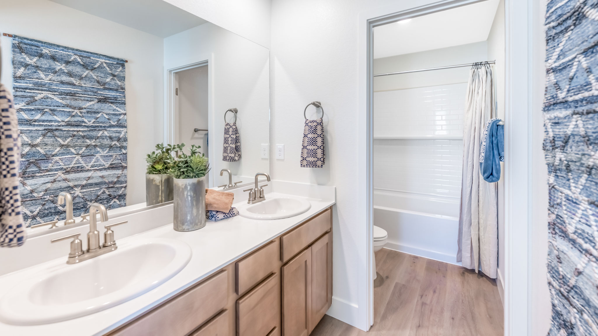 Secondary bathroom with separate room for toilet and bathtub and shower combo