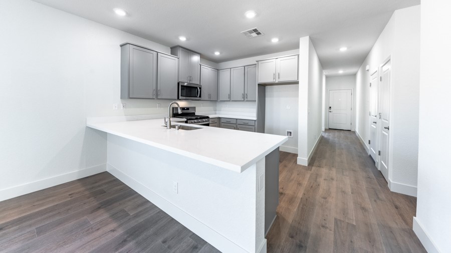 Modern kitchen with L shaped island bar