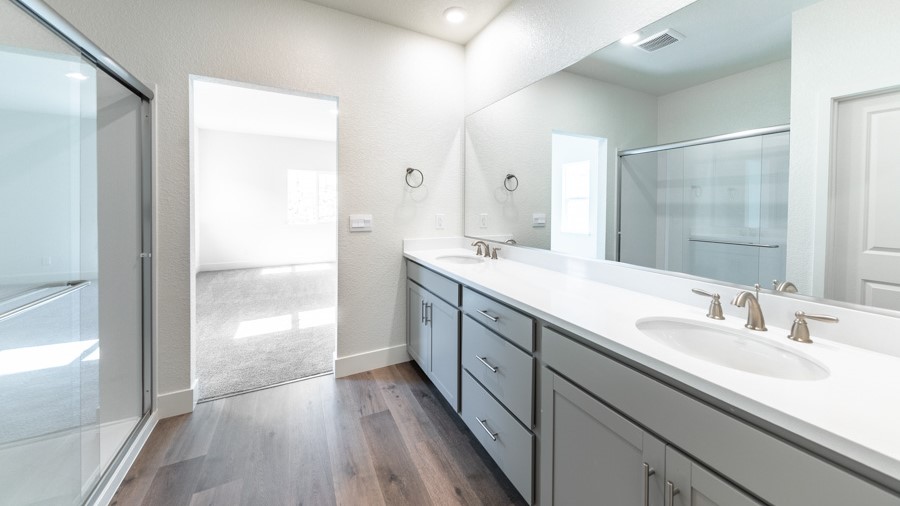 Primary bathroom with shower and double vanity