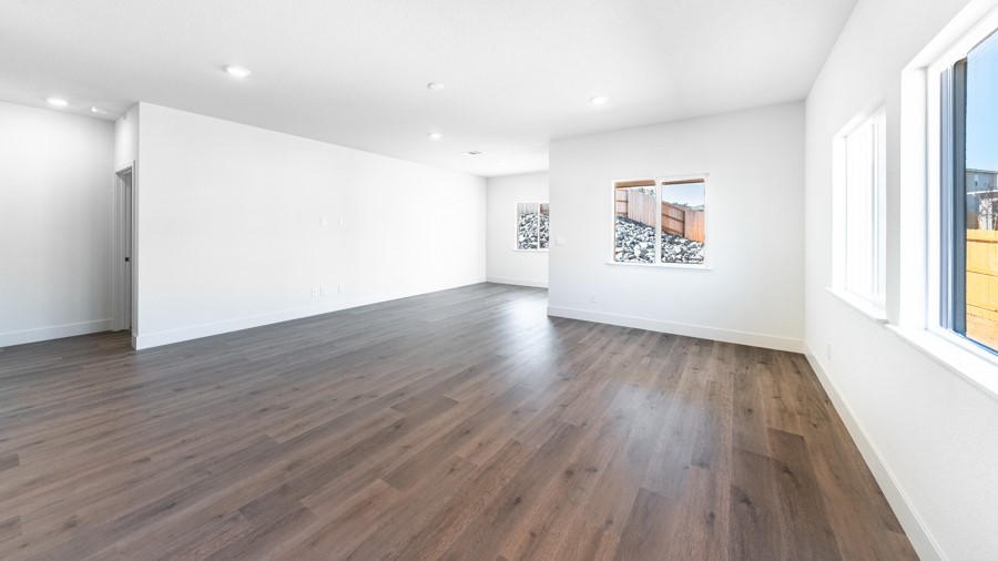 Living room next to kitchen in open concept living area