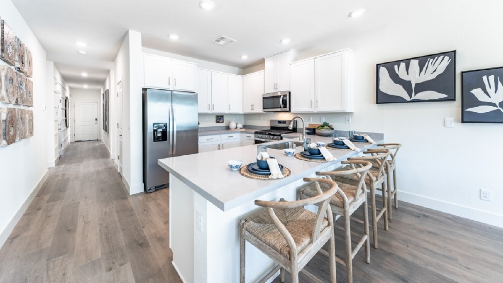 Large kitchen with shaker-style cabinets, and stainless steel appliances