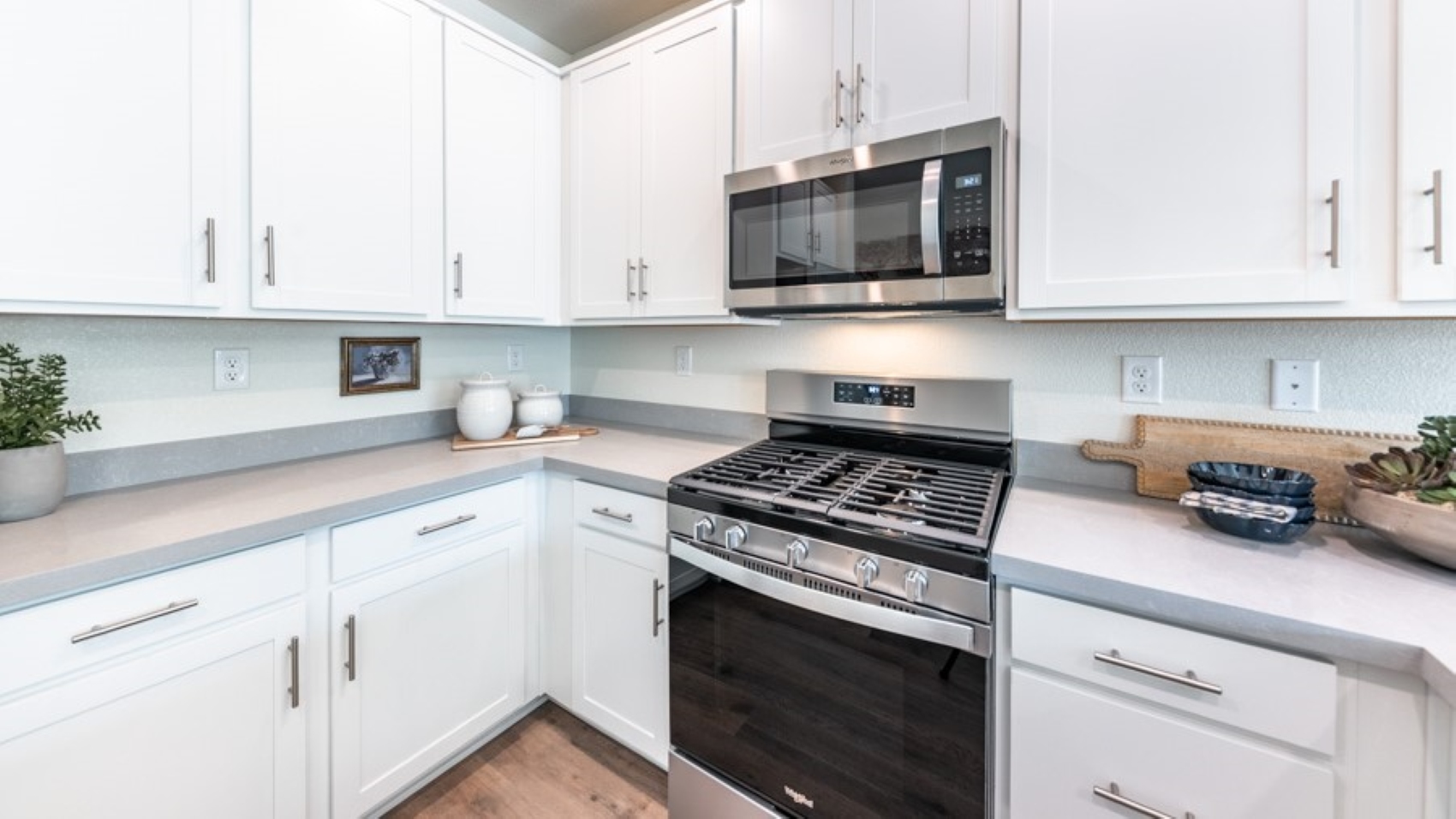 Modern shaker-style cabinets and stainless steel appliances