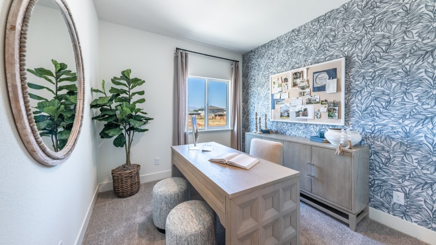 Carpeted secondary bedroom decorated as an office