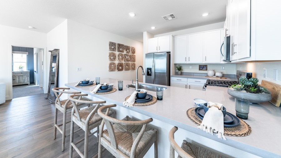 Modern shaker-style cabinets and stainless steel appliances