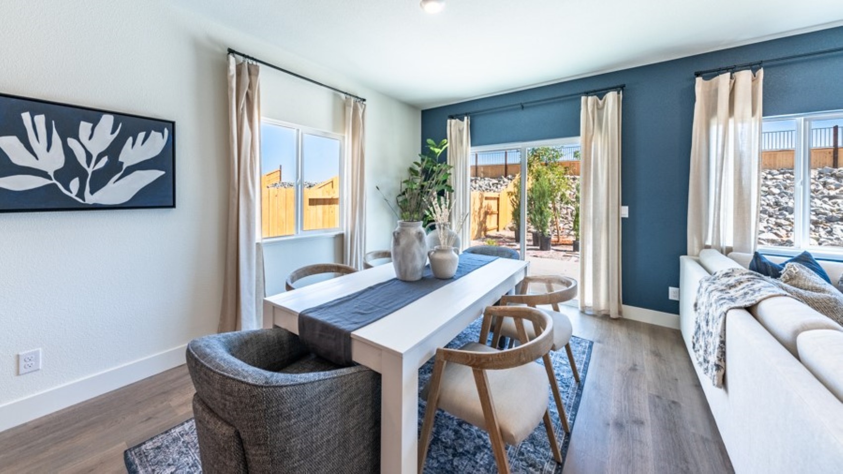 Dining area with access to back door looking into living room
