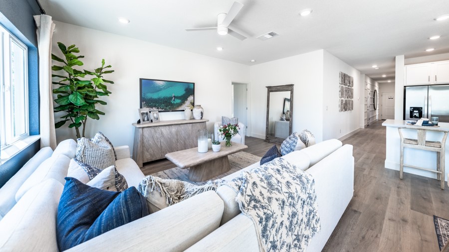 Large living area with a large window and room for a sectional couch