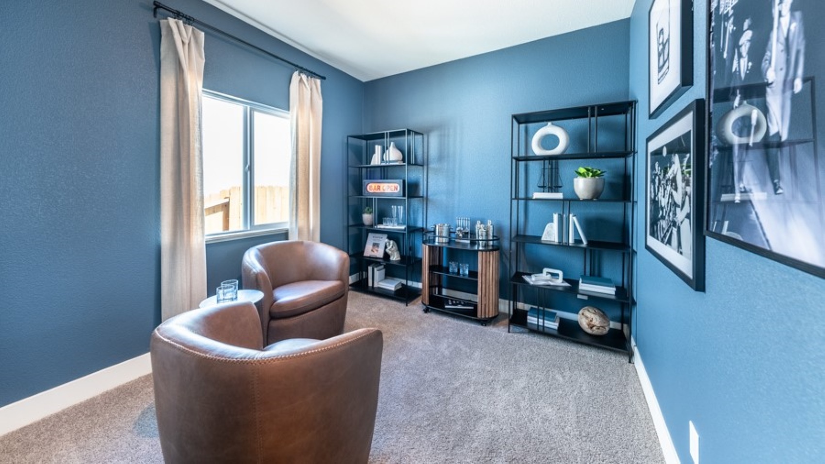 Carpeted secondary bedroom decorated as a lounge