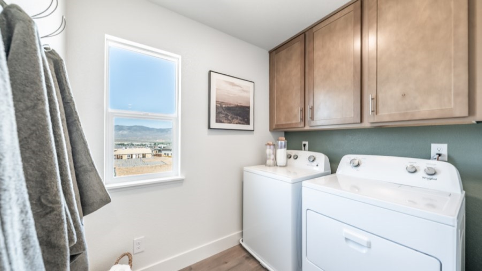 Second floor laundry room with window and plenty of room for a full sized washer and dryer
