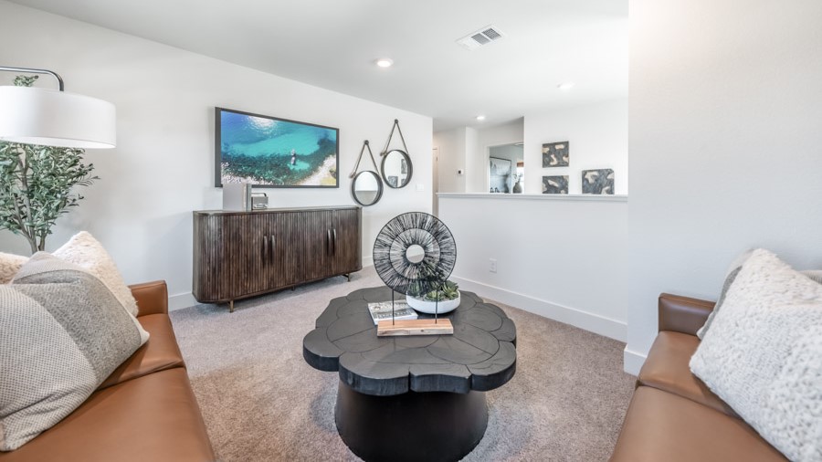 Loft decorated as a media room on second floor